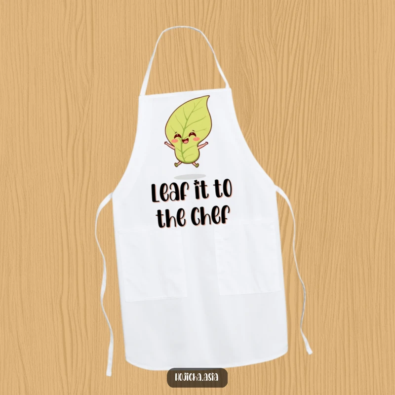 Funny hojicha tea leaf apron with a smiling leaf jumping cheerfully in a breeze, perfect for culinary fun.